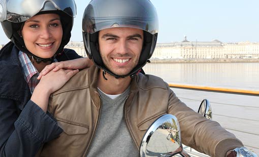 Couple on motorcycle for motorcycle insurance